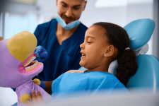 black-little-girl-learning-how-to-brush-teeth-prop-2024-12-13-16-42-42-utc